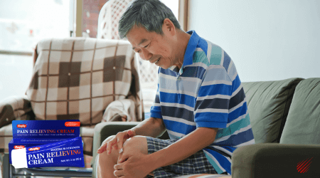 Man putting on Rugby Pain Relieving Cream for his arthritis